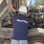 imachine engineer performing deep technical inspection on used machinery at Ethiopia construction site.