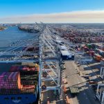 Port congestion aerial cover with container cranes and ships